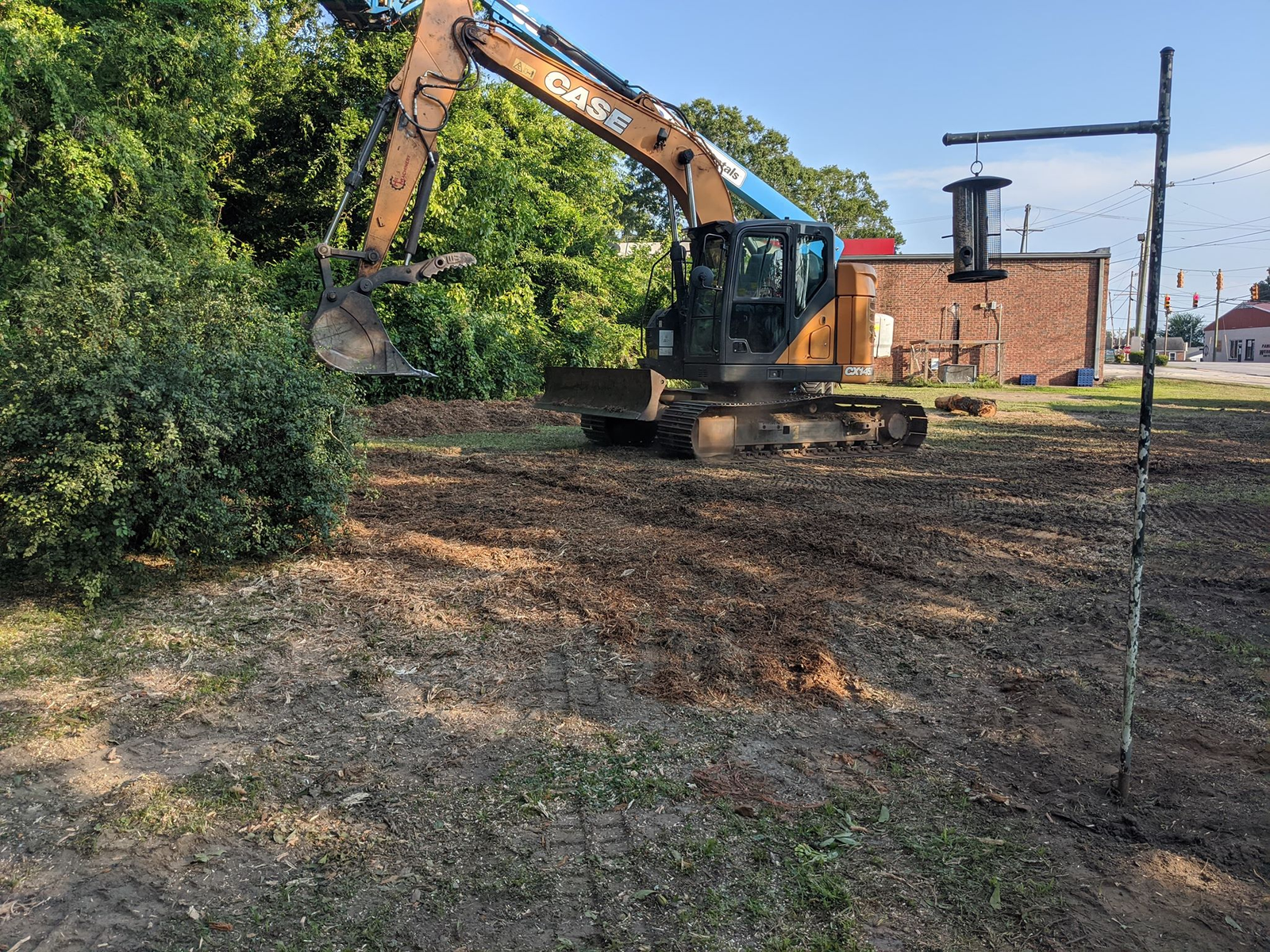 Excavator clearing a job site